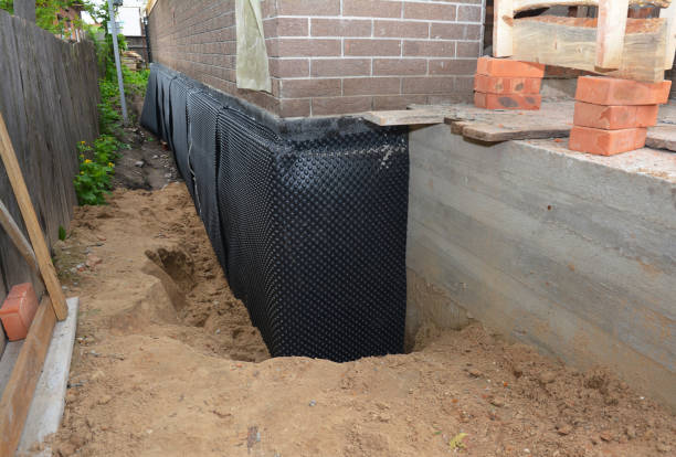 Happy homeowners after waterproofing job in Allons